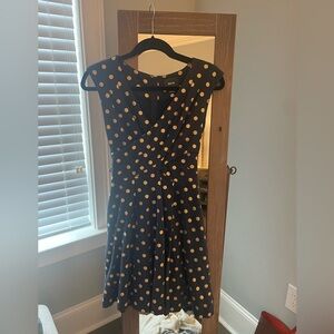 Navy and gold polka dot fit and flare dress